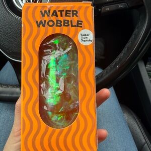 J’ADORE Water Wobble Iridescent Water Fidget Toy - Orange Packaging